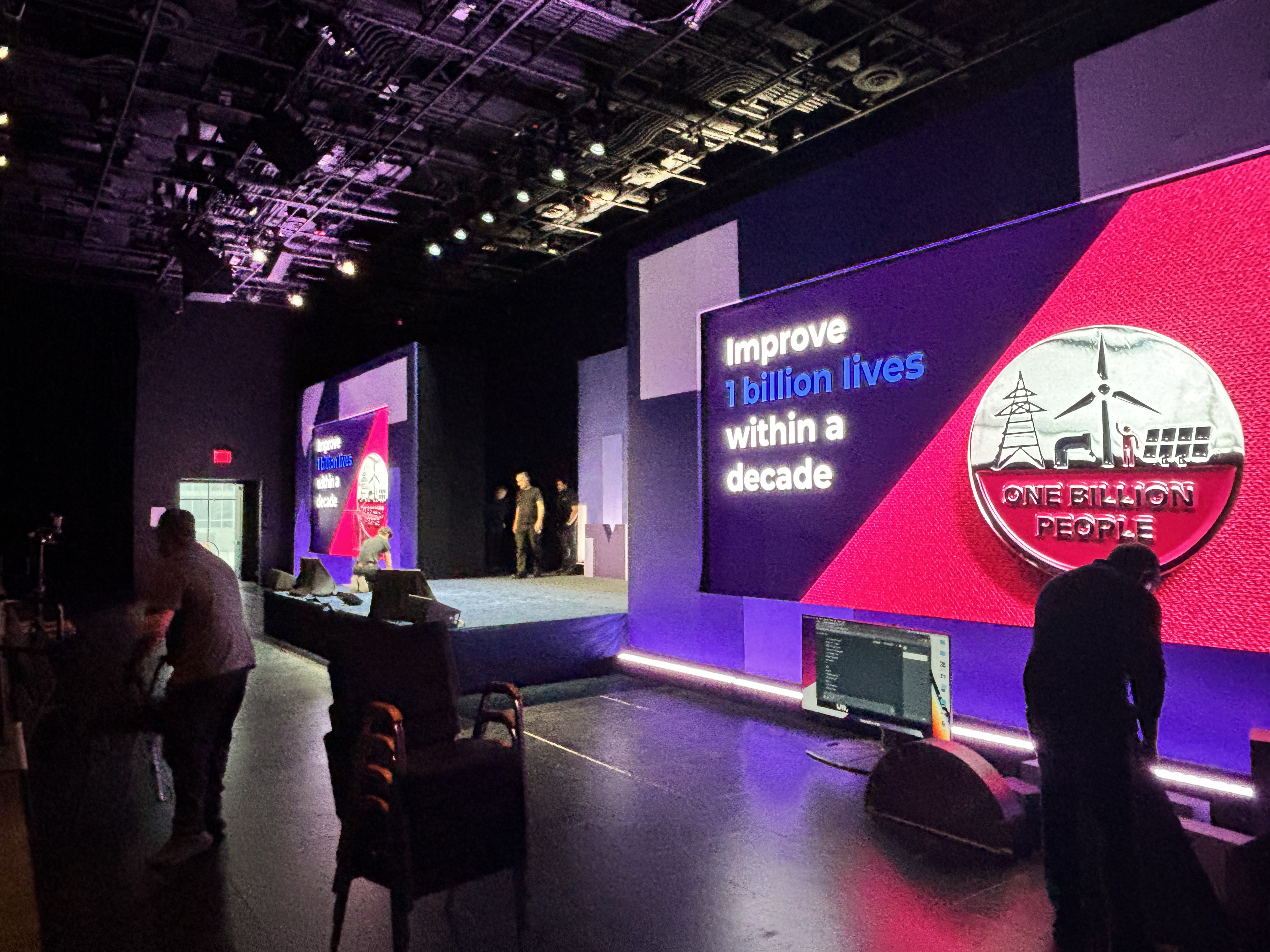 Impact stage set with 'Improve 1 billion lives within a decade' messaging