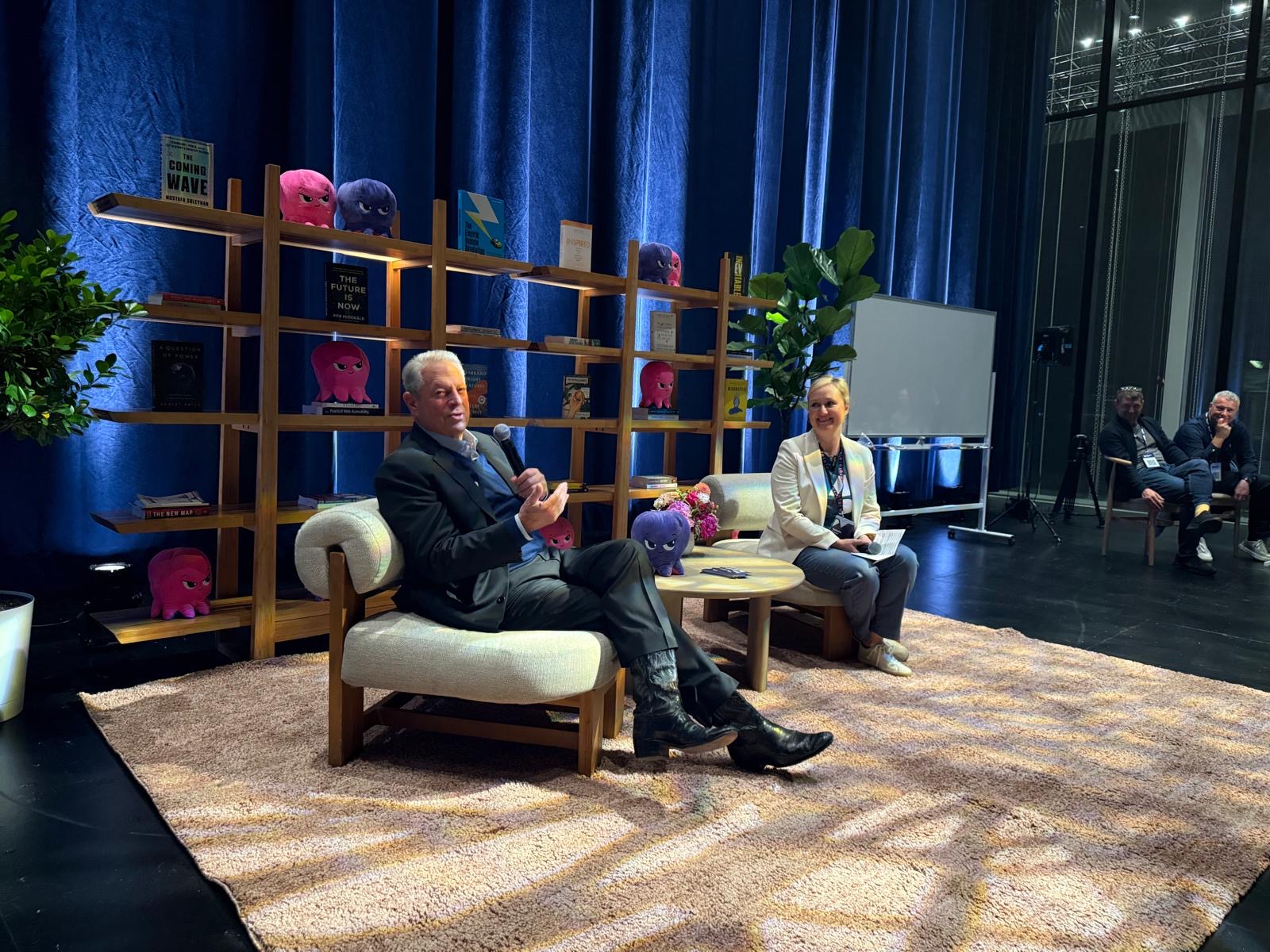 Natasha Crowe interviewing Al Gore on stage at Impact